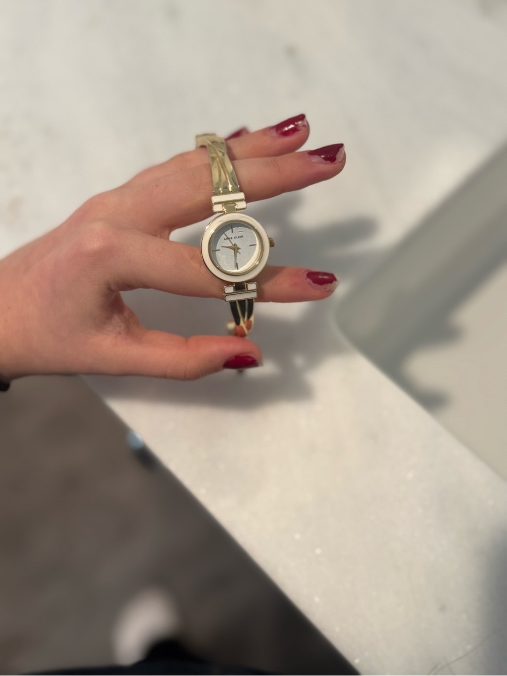 Anne Klein Ladies Gold-Tone Bangle Watch with White Dial